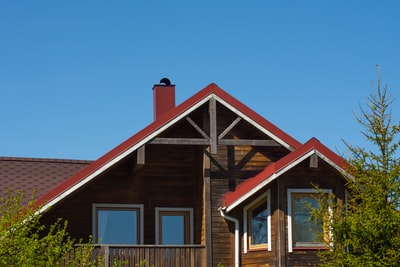 Brown wooden house under the blue sky during the day
